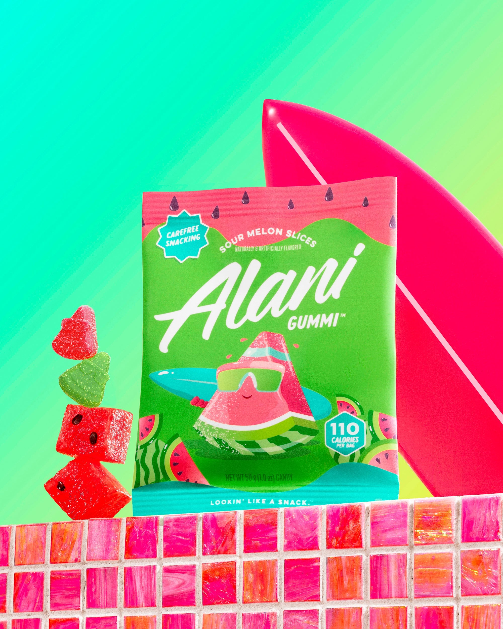 Alani Gummi’s gluten-free Sour Melon Slices stacked on a countertop near a mini surfboard.